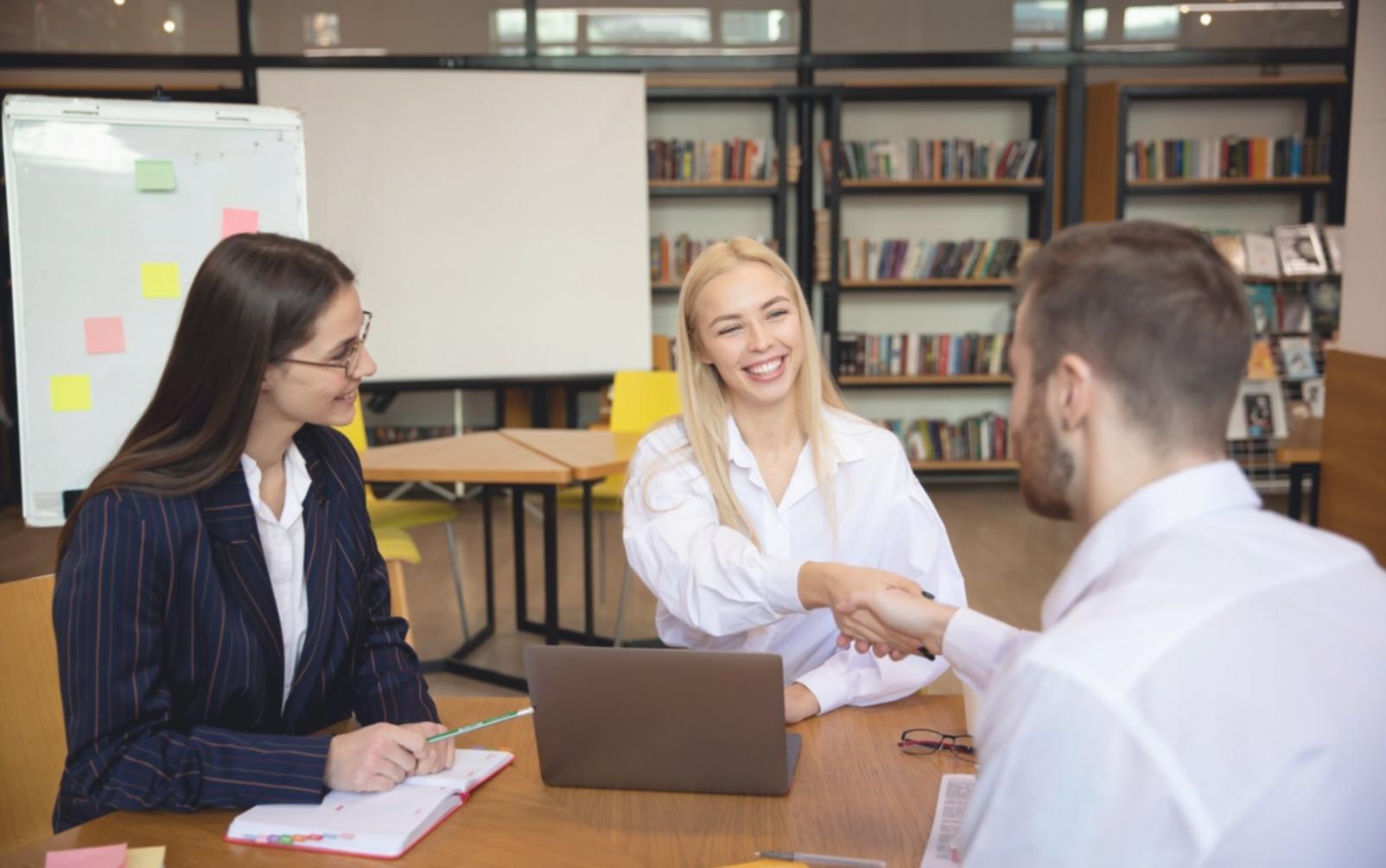 Modern trading floor with analysts working on financial models and market analysis