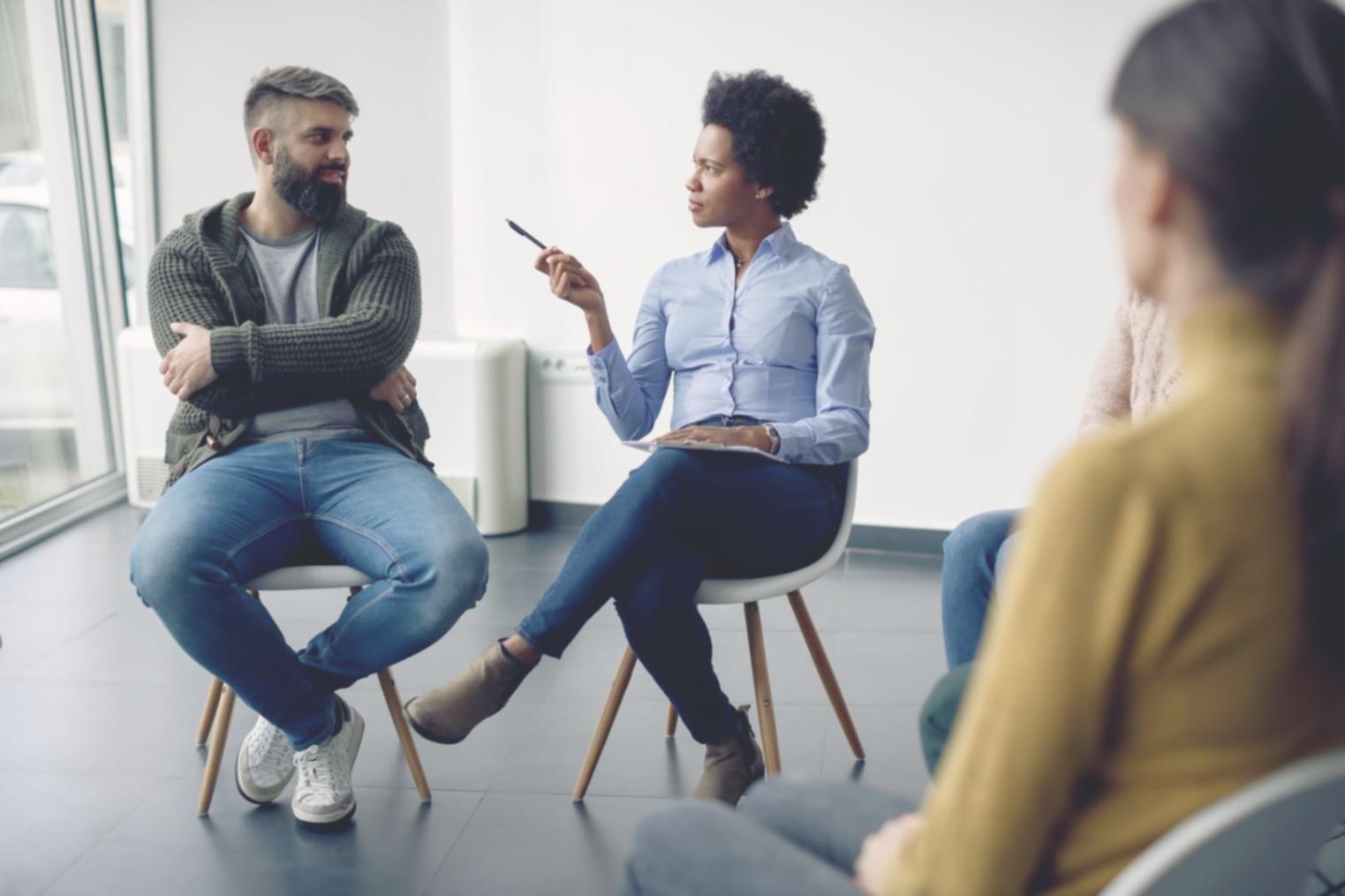 Financial professionals collaborating on valuation analysis using modern technology and analytical tools