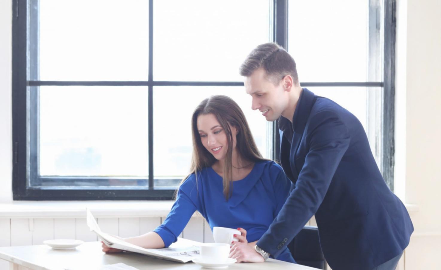Students working through financial modeling exercises on laptops